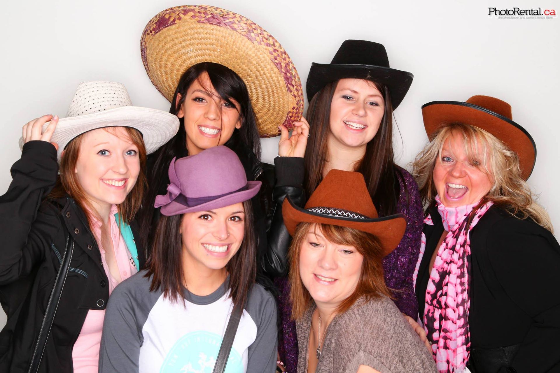 Friends in cowboy hats and props